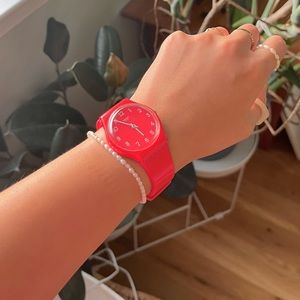 Swatch water resistant watch in red and white
